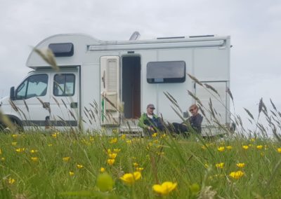 Joel and Becky sitting by Baloo